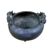 A Chinese bronze tripod censer with naturalistic twin handles, Xuande mark, 16cm in diameter