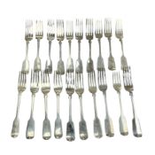 A harlequin set of twenty 19th century silver fiddle pattern table forks, various dates and makers