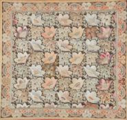 A framed late 19th century silk floral embroidery on brown and red woven background, embroidered