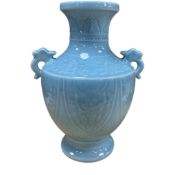 A Chinese blue glazed twin handled vase decorated in low relief, height 32cm