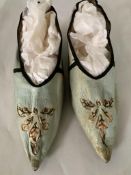 A pair of early 19th century ladies fine pale blue kid leather, black kitten heeled shoes, with