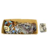 A collection of costume jewellery, including a paste ring in silver and gold; a bracelet depicting