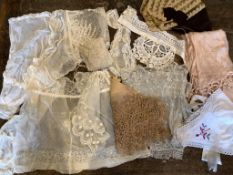 A collection of mixed late 19th and early 20th century ladies dresses, camisoles, hats scarves