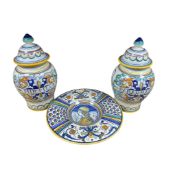 A Deruta maiolica circular pottery dish and a pair of jars and covers, “Mirtillo” and “Rabarbaro”