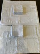 Two French finely worked ‘drawn thread’ linen table cloths, with matching monogrammed napkins, one