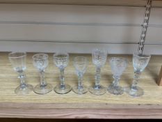 Five George III facet stem drinking glasses and two others, largest 15cm high