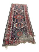 A Caucasian runner, 252 x 104cm (damaged)