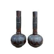 A pair of late 19th/ early 20th century Japanese bronze vases, height 25cm
