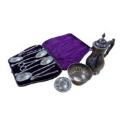 A late Victorian cased silver plated dessert set, comprising four serving spoons, a pair of grape