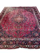 A Heriz red ground carpet, 322 x 267cm