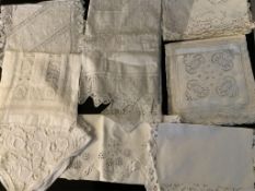 A collection of hand made linens; including white worked, embroidered, drawn thread, cut work and