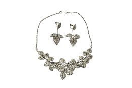 A silver and paste demi-parure, comprising: a necklace and pair of earrings, each designed as
