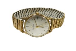 A gentleman's 9ct gold Jaeger LeCoultre manual wind wrist watch, with baton numerals and case back