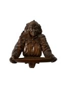 A 19th century carved fruitwood 'Jester' wall bracket, width 40cm, height 45cm