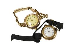 A lady's George V 15ct gold manual wind wrist watch, with Roman dial, case diameter 25mm, on a black