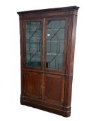 A George III mahogany standing corner cabinet, width 125cm, depth 60cm, height 202cm