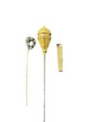 A Victorian yellow metal topped hat pin, 14.6cm, a yellow metal, synthetic sapphire and seed pearl