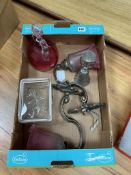 A pair of wall sconces with cranberry shades, a cranberry decanter, Wager cup and glass biscuit