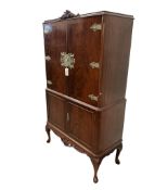 A Queen Anne revival walnut cocktail cabinet, width 85cm, depth 42cm, height 153cm