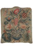 An early 19th century Jacobean revival floral wool worked panel, possible originally a chair back,