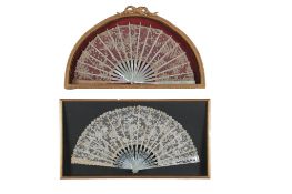 Two 19th century mother of pearl Brussels lace fans framed and glazed. One with a central Point de