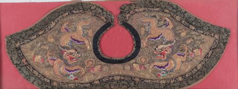 A framed 19th century Chinese gold couched and coloured embroidered shaped collar, ornately