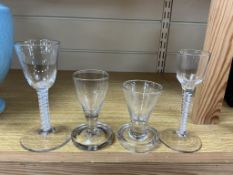 Two George III opaque twist glasses and two toasting glasses, largest 15cm high