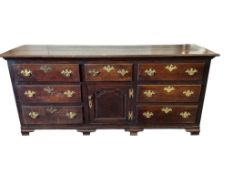 An 18th century oak low dresser, width 218cm, depth 62cm, height 94cm