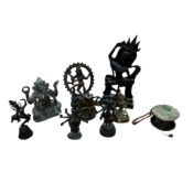 A group of Tibetan style bronze, brass and composition figures of deities, largest 29cm high