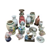 A collection of Chinese and Japanese ceramics, including various vases, a ginger jar, Imari-style