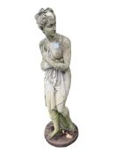A reconstituted stone female bather garden ornament, height 116cm