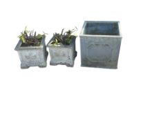 A pair of square reconstituted stone garden planters, 29cm, a larger faux lead planter and a parasol