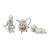 Two Meissen white glazed figures, Cupid with Bow and recumbent donkey, larger 14cm, and a jug
