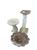 Three reconstituted stone garden bird baths, largest height 74cm