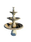 A reconstituted stone graduated three tier garden fountain, height 178cm