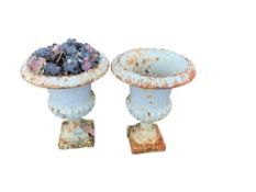 A pair of small Victorian painted cast iron campana urns, diameter 25cm, height 32cm
