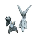 Three painted stone griffin and gargoyle ridge tiles, largest height 66cm