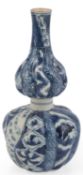 A Japanese blue and white double gourd sake flask, possibly Edo period, painted with swirled