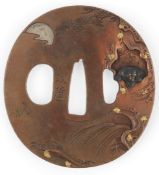 A Japanese copper and mixed metal ‘panther’ tsuba, Shonai School, signed Aizen, 19th century,