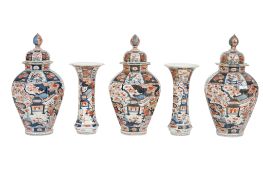 A garniture of five Japanese Arita vases, Genroku period (1688-1704), each painted in Imari