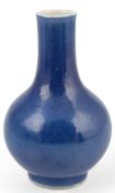 A Chinese small blue glazed bottle vase, early 19th century, with a fine crackle to glaze all