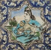 A Persian fritware square tile, Qajar dynasty, 19th century, decorated with a kneeling figure