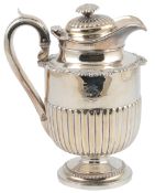 A George IV demi-fluted silver pedestal hot water pot by Thomas Burwash, with shell and gadrooned