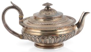 A George III demi-fluted silver teapot, by William Hunter II, of squat circular form, with