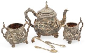 An ornate Victorian silver gilt three piece tea set by Richard Sibley I, of pyriform and embossed