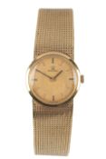 A lady's 1960's 18ct gold Omega manual wind bracelet wrist watch, with baton numerals and yellow