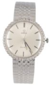 A gentleman's 18k white gold and diamond set Omega manual wind dress wrist watch, with baton