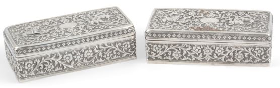 A pair of late 19th century Indian white metal rectangular trinket boxes by Oomerssee Mawjee,