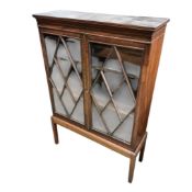 A George III mahogany bookcase on associated low stand, width 97cm, depth 33cm, height 142cm