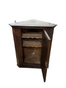 An 18th century style carved oak hanging corner cabinet, width 71cm, depth 42cm, height 87cm